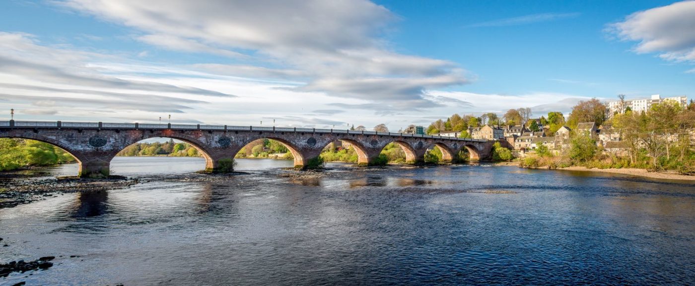 Scenic arched West Bridge across River Tay in Perth city, Scotland